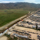 An aerial view of cargo trucks lining up in Tijuana to cross into California